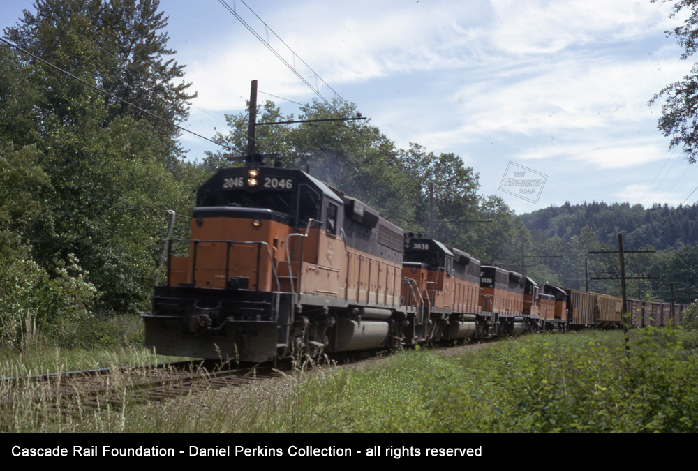 Train led by MILW GP40 2046 at Cedar Mountain, WA on June 12, 1973.  Daniel Perkins photo, Cascade Rail Foundation, Daniel Perkins Collection, all rights reserved