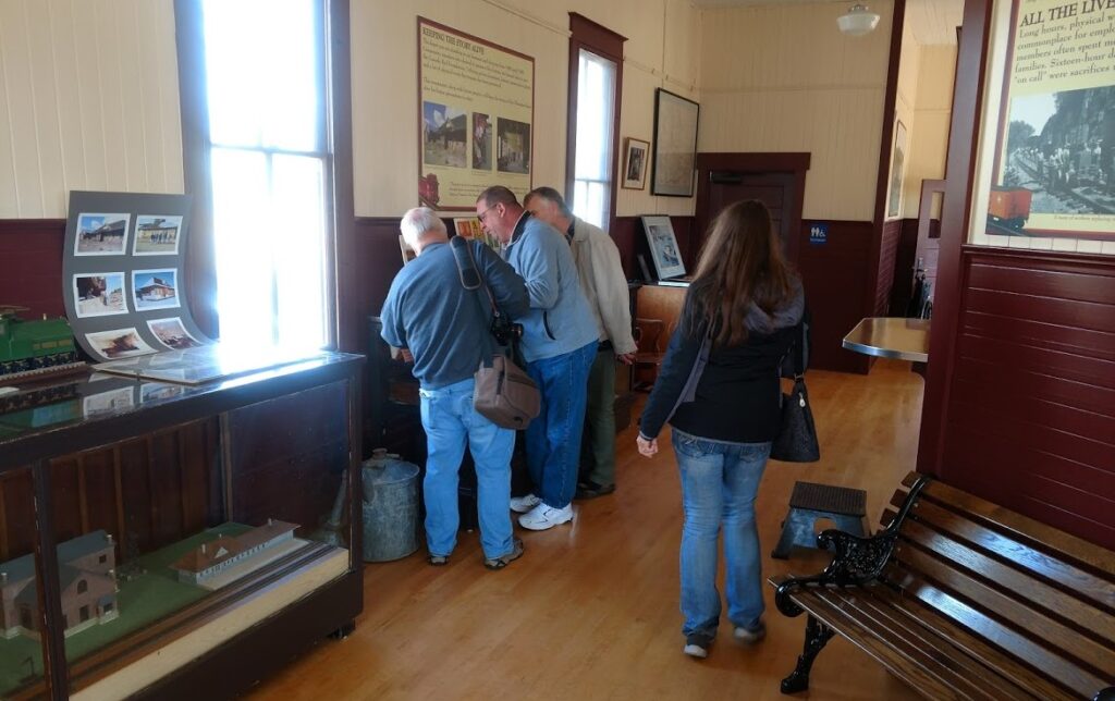 Visitors studying the depot displays