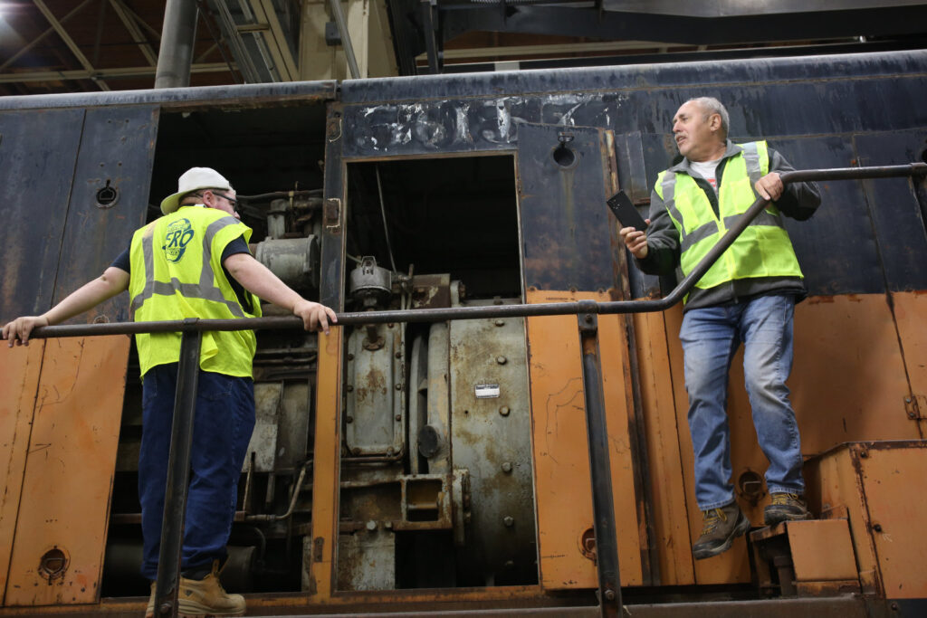 Attendees inspect the locomotive at the 5057 open house in October 2025 