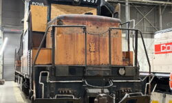 A view showing the front of the 5057 locomotive in the Columbia Rail shop.